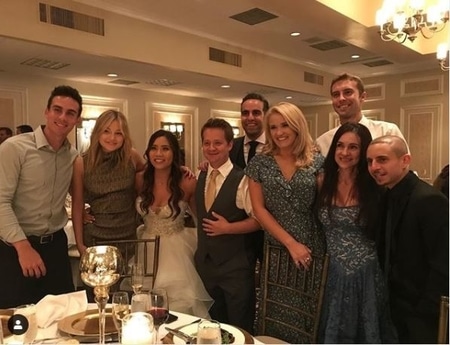 Katie Drysen and Jason Earles with Disney cast members at their wedding